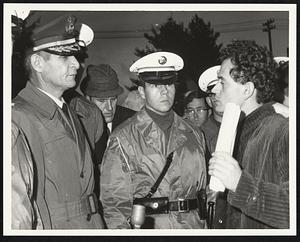 Left. Lt. Col. Chas. De Smet USA. P.I.O. officer Ft. Deven listens to Peter Camejo (right). He refused pickets request to enter Army post.