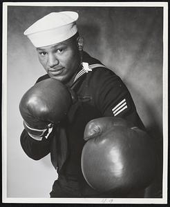 The 1952 Olympic heavyweight champ, Hayes E. "Big [Ed"] Sanders, Seaman, U.S. Navy, reported for duty at the C.[I.C.] (Combat Information Center) Team Training Center, Boston.
