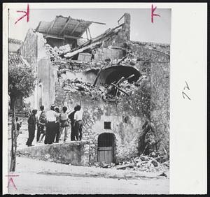 Hard Hit By 'Quake. This building, its upper portions caved in by the series of temblors in southern Italy, becomes a of wonder for inhabitants of Montecalvo small town near Naples. It was in this area Naples that the heavies damage was 'quakes.