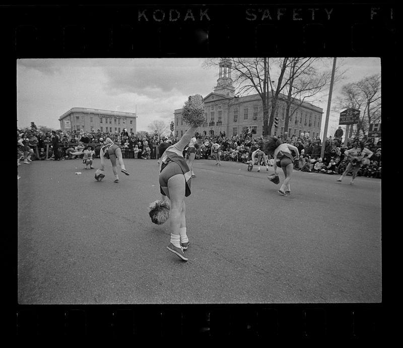 Cheerleaders do cartwheels in parade, Waltham