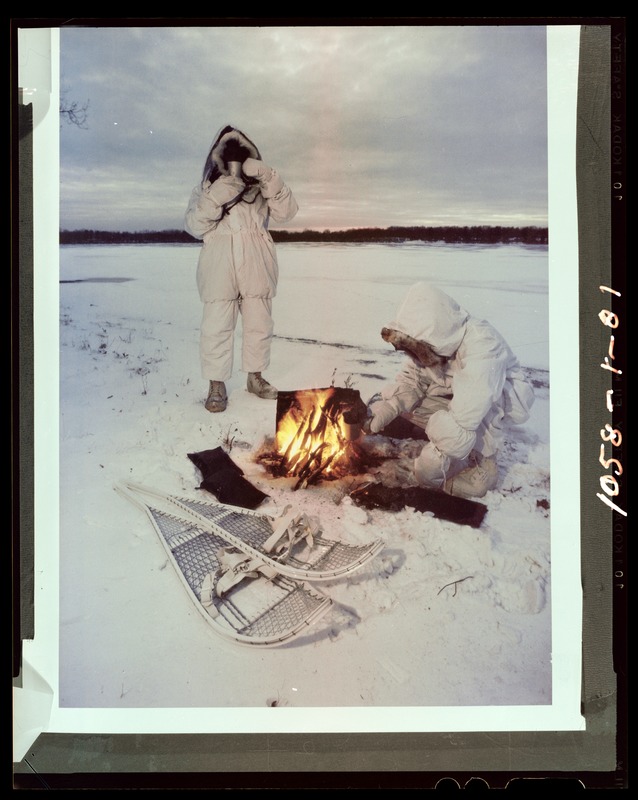 Artic men around campfire