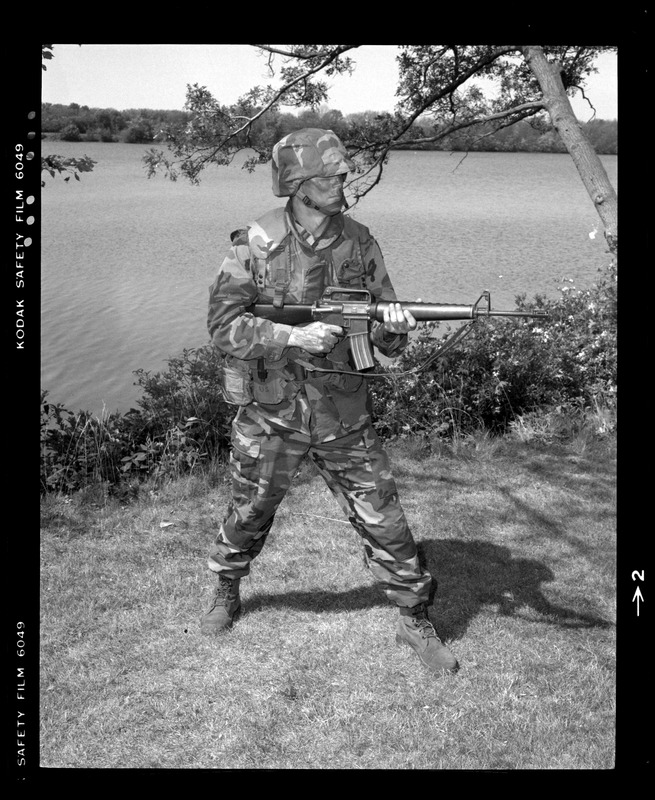 Combat arms div., front view, woodland uniform, Kevlar vest, helmet, no Alice