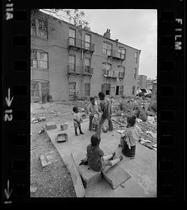 Overcrowded, black-owned, inner-city slum tenement