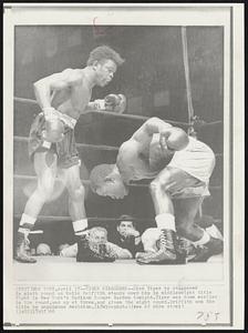 Tiger Staggered--Dick Tiger is staggered in ninth round as Emile Griffith stands over him in middleweight title fight in New York's Madison Square Garden tonight. Tiger was down earlier in the round, was up at three, and given the eight count. Griffith won the title by unanimous decision.