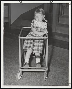 The Young are hardest hit when polio strikes. At right, little Ann Kylen, 4, learns to walk again at the Massachusetts Infantile Paralysis Clinic at the Children’s Medical Center.