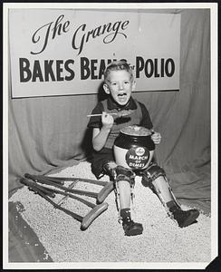 National Polio Poster Boy, 5-year-old Tommy Woodward of Baltimore, takes a heaping spoonful of baked beans the Massachusetts State Grange will serve in a statewide series of baked bean suppers for the March of Dimes Jan. 14. All 310 Granges are expected to take part, serving 15,000 pounds--or 30 million--beans. One of the largest dinners will be in Stoneham at 5 p.m. with 1000 attending. Herschel Newsome of Washington, D.C., national master of the Grange, will be a guest.