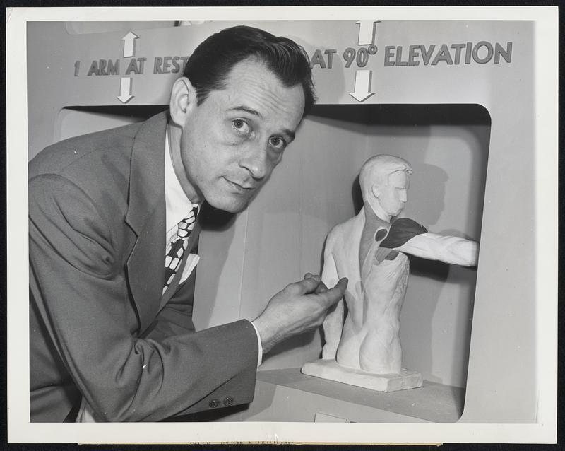 Exhibit Presents Polio Facts Roland H. Berg, with sculpture demonstrating rythm of shoulder muscle action. With this new knowledge, treatment to overcome the effects of paralyzed muscles has advanced significantly. This is part of the new display constructed by the National Foundation for Infantile Paralysis which will be shown at the American Medical Association to be held in San Francisco soon.