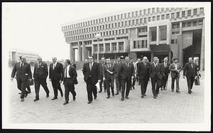 Mayor Kevin White and select men + mayor leave City Hall to attend hearing before committee on taxation at Statehouse.