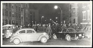 Students use cars to block TPF officers on Hemingway St
