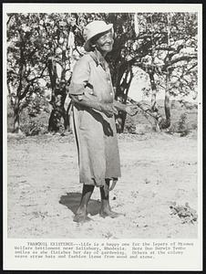 Tranquil Existence--Life is a happy one for the lepers of Mtemwa Welfare Settlement near Salisbury, Rhodesia. Here Duo Darwin Tembo smiles as she finishes her day of gardening. Others at the colony weave straw hats and fashion items from wood and stone.