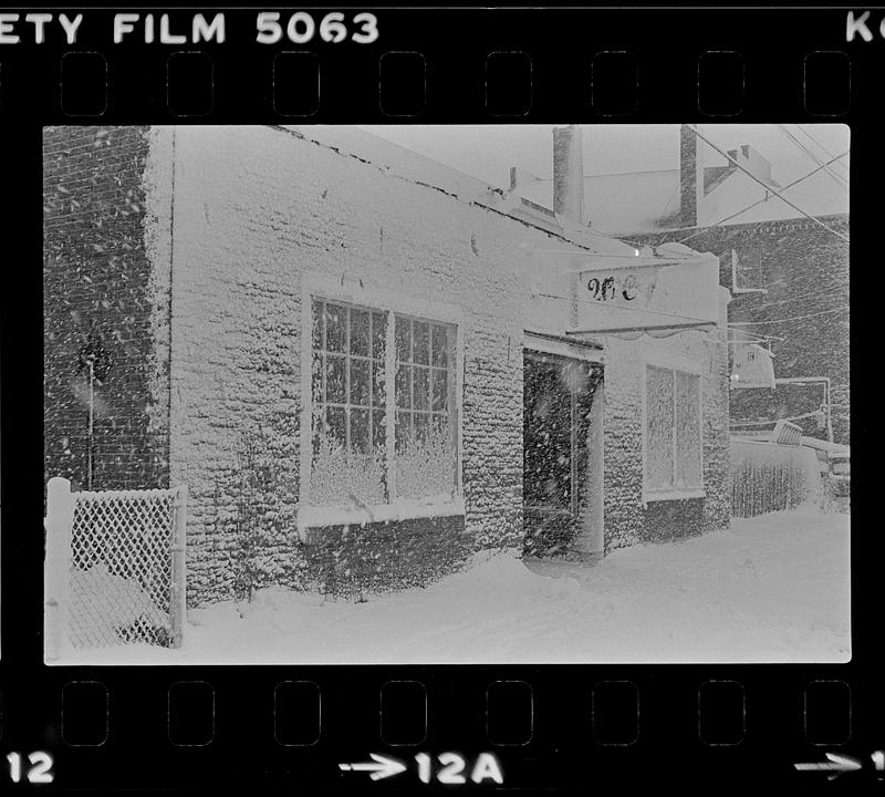 Building covered in snow during storm