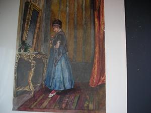 Woman in ankle length dress and grey shawl