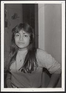 A young woman posing with her hand on her hip