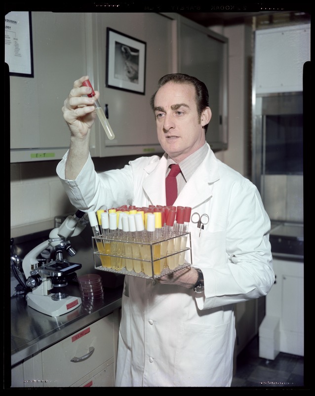 FSL, Ed Powers, checking out test tubes in lab