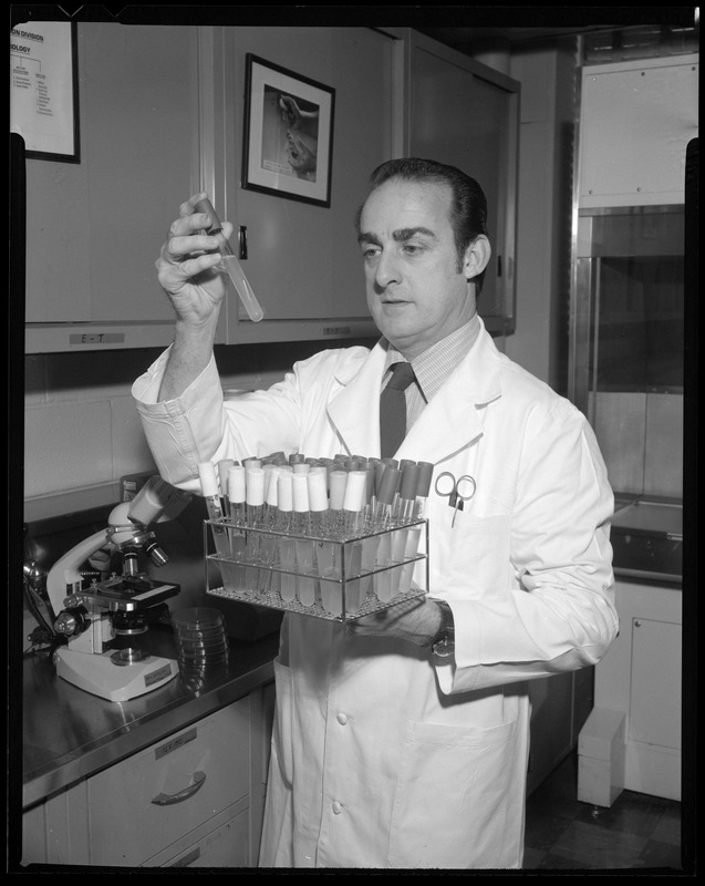 FSL, Ed Powers, checking out test tubes in lab