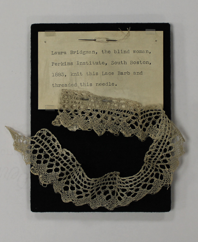 Threaded needle and strip of lace (barb), made by Laura Bridgman