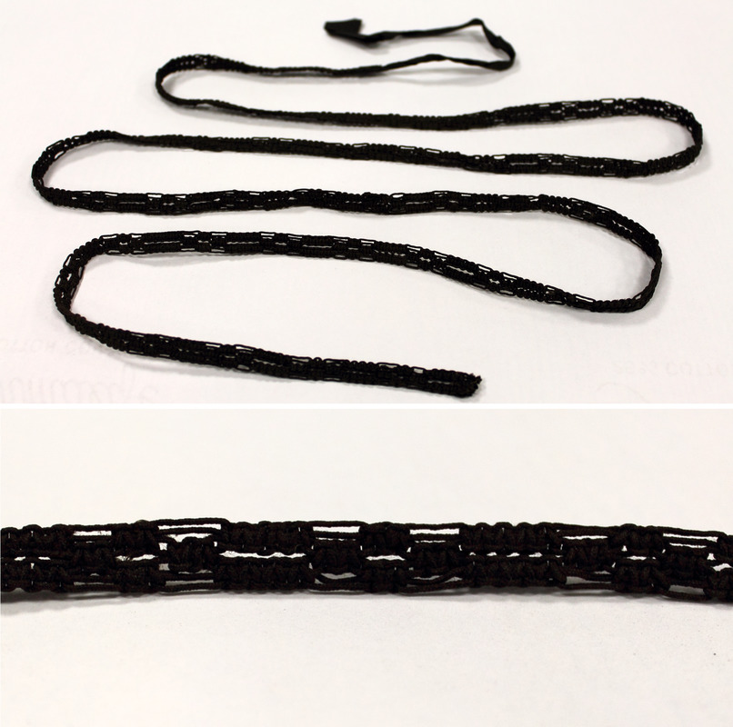 Length of black macramé, made by Laura Bridgman