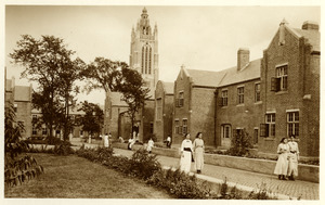 Young Women Outside Cottages
