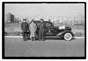 Policemen standing next to Boston Police Safety Education vehicle, Back Bay Fens