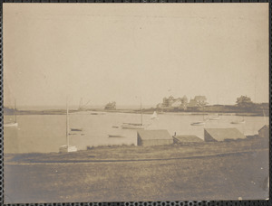 Shoreline with boats, buildings and possibly a hotel