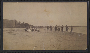 Bathers at Bass River, South Yarmouth, Mass. with bathhouses at left