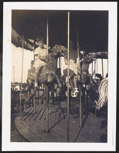 Ireton Bradshaw Jr. riding merry-go-round