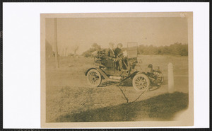 Morris and Mary Johnson in car in front of Abby K. Johnson's home, Route 28, West Yarmouth, Mass.
