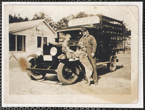 Alton F. Dunbar, driver for Drew's Auto Express, at Frank Tripp's house with a little boy and dog by the truck