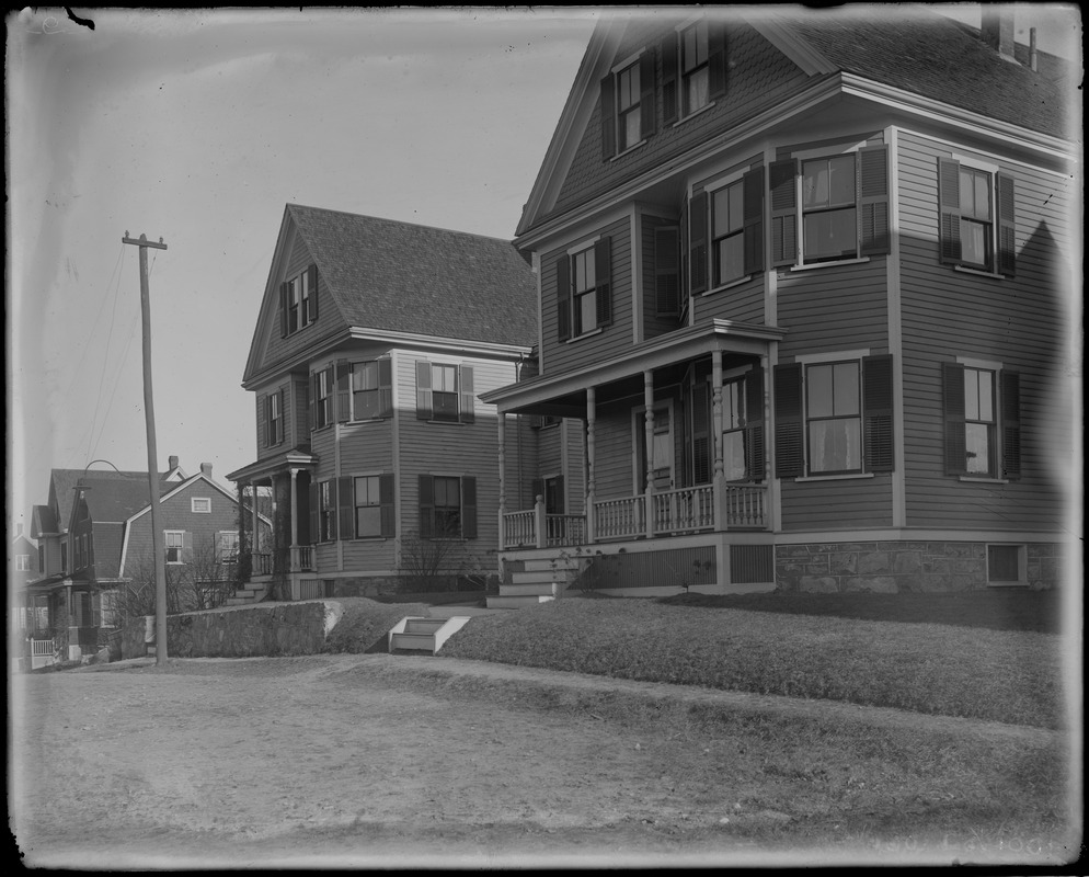 Close up of two houses from the street