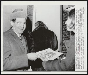 A smiling Brandeis Univ. President Morris Abram is handed a leaflet made up by the suspended black students who have barricaded themselves in the University's Ford Hall building. The negro students have occupied the building since (1/8).