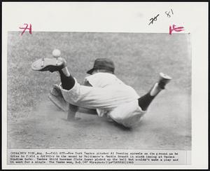 Fall Guy -- New York Yankee pitcher Al Downing sprawls on the ground as he tries to field a dribble to the mound by Baltimore's Jackie Brandt in sixth inning at Yankee Stadium today. Yankee third baseman Clete Boyer picked up the ball but couldn't make a play and it went for a single. The Yanks won, 3-2.