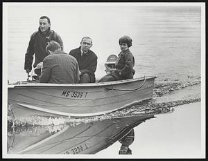 Orientation tour along flooded Lake Sabbatia shore from left: five Lieut Manual Ferreira steering boat Bill McDermont Mrs. Hecklers secretary Congressl. Margaret Heckler
