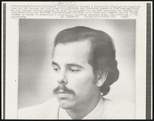 Reed L. Gibson, 27, for 6-years a Sacramento fireman, faces dismissal from his job because his long brown hair, mustache and sideburns present a fire hazard. Gibson, who has refused several requests to trim his hair, said he has been suspended for 30-days for "insubordination and willfull disobedience." Officials said Gibson put himself and his fellow firemen in danger by presenting a potentially dangerous personal brush fire condition by his appearance.
