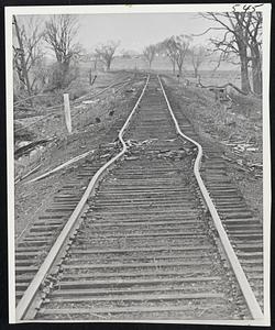 Tremendous Force of tornado is shown by twisted railroad tracks near Monroe, Wis.