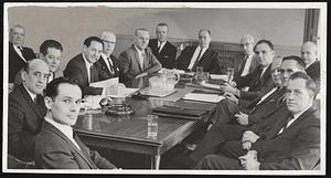 Mediation Meeting in Lynn City Hall today as officials of General Electric Co. and representatives of striking workers seek end to 25-day strike. Participating are from left, Executive Board members Henry Blanch, Michael Kraine, Charles Mullen, Atty. Albert Goldman, Hugh McManus, Raymond Luncker, Edward McMahon, federal mediators Frank McDonnell and Dan Hurley, R.C.W. Thelen, Atty. James Sack, Raymond Holland, Robert Farrell, Francis Moorehouse and Selig Danzig. At far left, and also taking part in the talks, is Executive Board member Phil Sweeney.