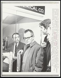 Bill Corrigan (with glasses), member of the Catholic Peace Movement and a Lutheran minister Rev. Ray Michaelton (R) attempted to enter the offices of the Dow Chemical Co. A Dow official, behind locked doors, received a letter through opening, which explained the reasons for the demonstrations. About 20 anti-war demonstrators picked the building.