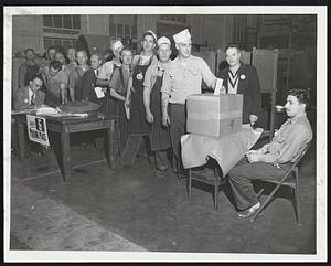 Battle of the Ballots at the River Works of the General Electric Company in Lynn as workers line up to vote. Question: Whether the IUE-CIO or the independent UE will be their bargaining agent.