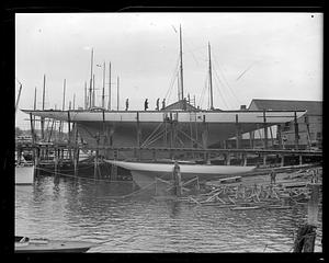 People on top of "Whirlwind" in dry dock