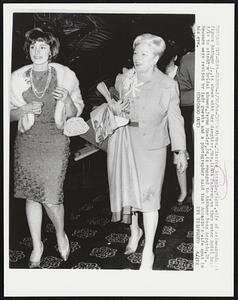 Mrs. Clarice Accardo, right, wife of crime-syndicate figure Anthony J., is shown with her daughter, Mrs. Linda Palermo, as they enter hotel here 5/19 to attend a bridal shower. Jayne Hawley, 24, is engaged to Anthony Ross Accardo, 28. Newsmen were reviled by lady guests and a photographer said that Accardo’s wife spat in his eye.