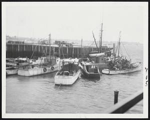 Safe, After Riding Out The Storm were these fishing boats, tied up protectively beside a pier in Scituate Harbor.