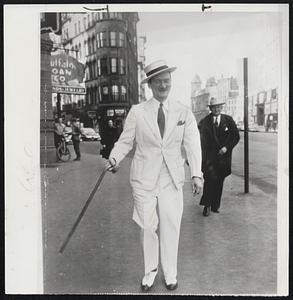 Mid – Winter Garb – Syracuse’s hottest winter day on record brought this jaunty gentleman out dressed fit for Easter. His white suit and straw-hat sub for the usual winter raiment of this Central New York snow belt-high topped boots and overcoat. His name is Norman Meservey and he appeared on Syracuse’s main street as the thermometer hit 70.