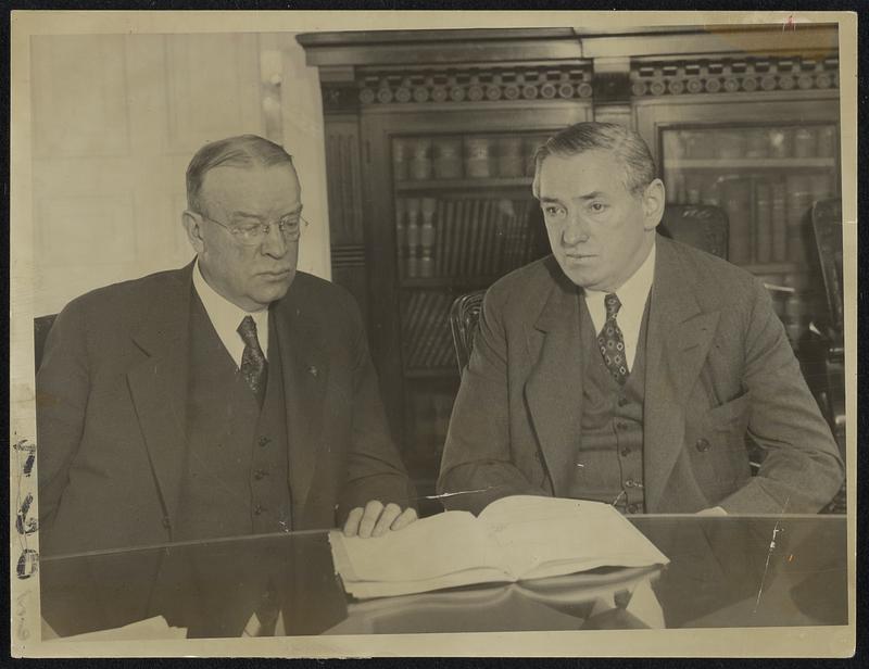 Mayor-elect Mansfield and Mayor Curley hold their first meeting at City Hall on municipal problems.