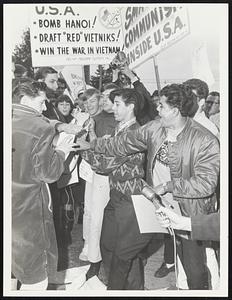Fort Devens. Pro + Anti Johnson’s policy, crowd. Clash, and Pro Johnson, rip up Anti-Johnson Policy.
