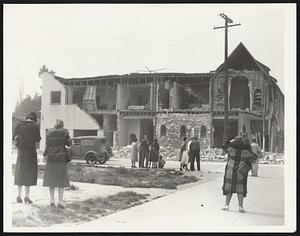 Taking Pictures of Quake Ruins. Making the best of a bad situation. Citizens of Long Beach, Calif., their homes damaged or destroyed by earthquake, get out their cameras and take pictures of the ruins. It's a story to tell their grandchildren.