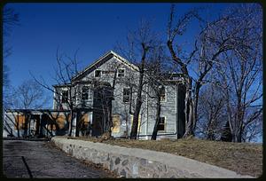 A house with boarded up windows