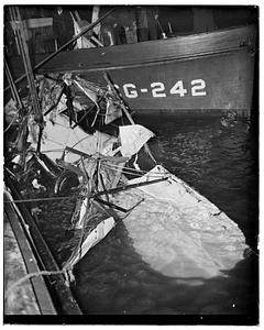 Aircraft wreckage next to Coast Guard cutter CG-242