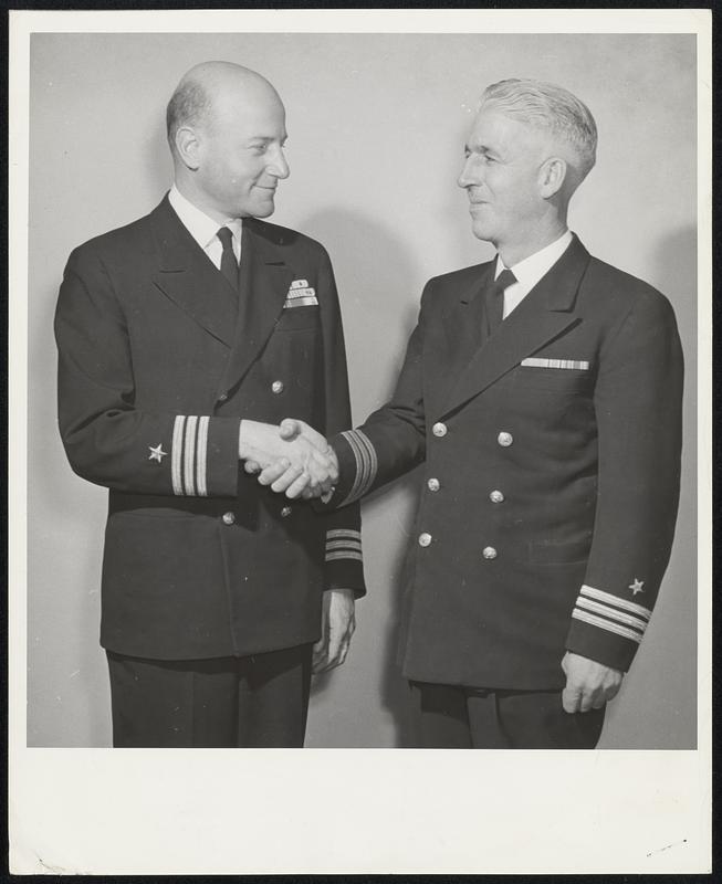 Leaves Navy–Comdr. Charles Francis Adams, Jr., left, of 166 Marlboro street, son of the former Secretary of the Navy during the Hoover administration, is honorably discharged at the First Navy District Separation Center. Here he is given a Navy farewell by Comdr. R. P. Bowles, USNR. Comdr. Adams plans to return to the firm of Paine, Webber, Jackson and Curtis, investment bankers.