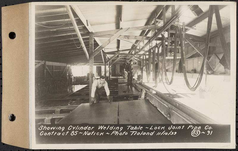 Contract No. 85, Manufacture and Delivery of Precast Concrete Steel Cylinder Pipe, Southborough, Framingham, Wayland, Natick, Weston, showing cylinder welding table, Natick, Mass., Nov. 10, 1939