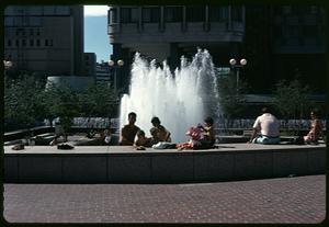 People sitting by fountain, Boston City Hall Plaza