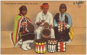 Pueblo Indians making hollow log drums